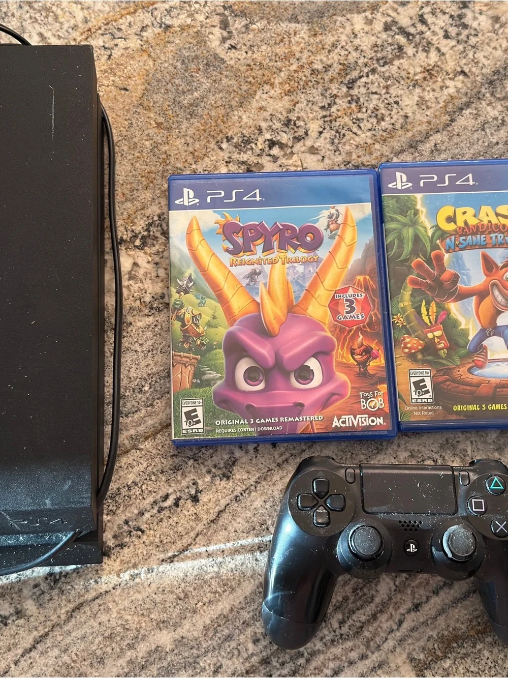 Sony PlayStation 4 Black Console with 2 PS4 Controllers and Spyro & Crash Games